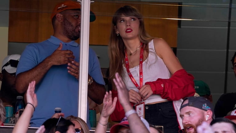 Taylor Swift watches from a suite inside Arrowhead Stadium during...