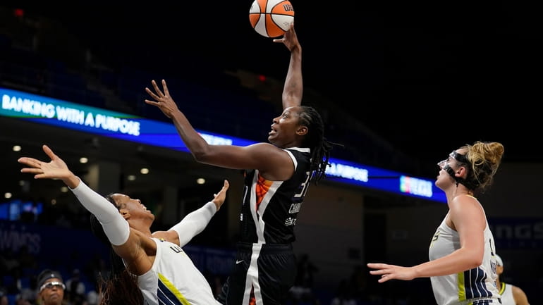 Dallas Wings' Kayla Thornton, front left, and Marina Mabrey, right,...