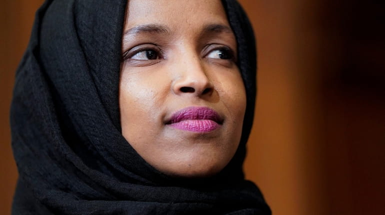 Rep. Ilhan Omar (D-MN) listens as lawmakers speak about the...