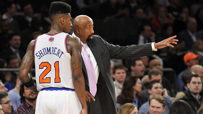 Iman Shumpert of the Knicks talks to coach Mike Woodson....
