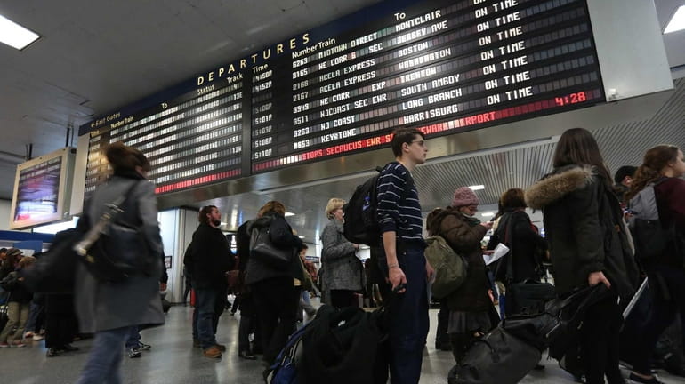 The scene at Penn Station as travelers begin their holiday...