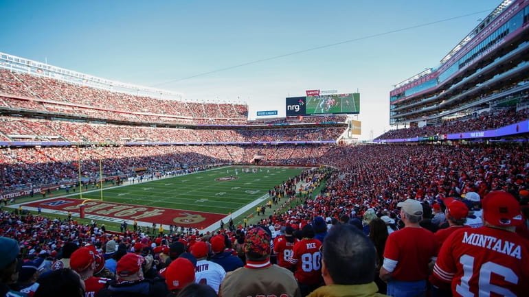 Fans at Levi's Stadium watch the first half of an...