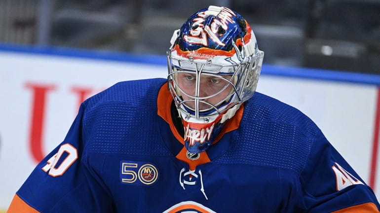Islanders goaltender Semyon Varlamov protects the net against Chicago in...