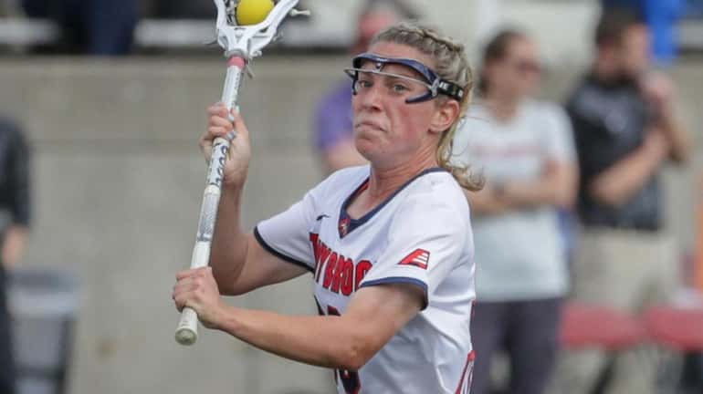 Ally Kennedy of Stony Brook drives up field against Albany during...