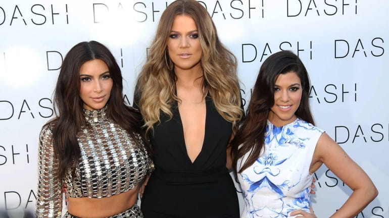 Kim Kardashian, Khloe Kardashian and Kourtney Kardashian attend the grand...