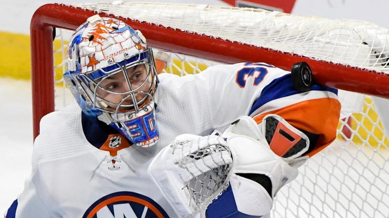 New York Islanders' goaltender Ilya Sorokin (30) makes a save...