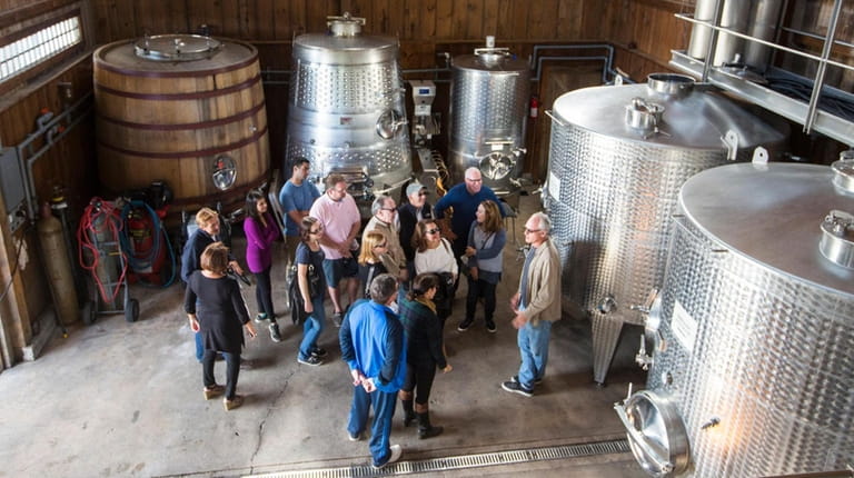 A tour of explaining barrel aging and fermentation offered over...