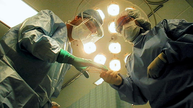 Doctors in a operating room.