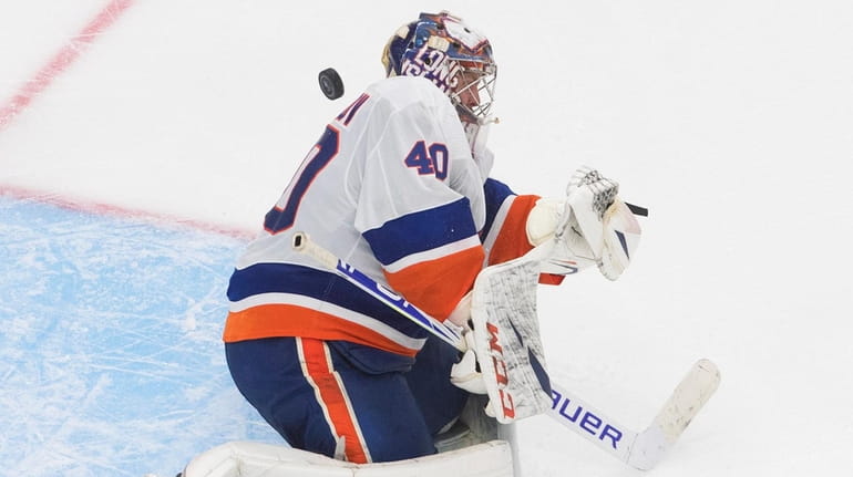 Islanders goaltender Semyon Varlamov makes a save against the Lightning...