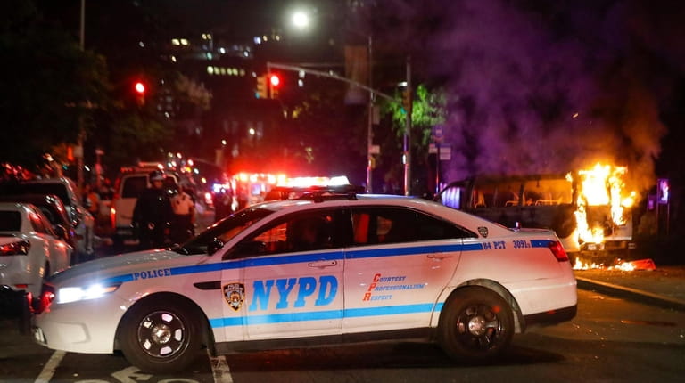 NYPD officers block off DeKalb Avenue in Brooklyn as demonstrators took...