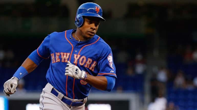 Curtis Granderson runs the bases after hitting a solo home...