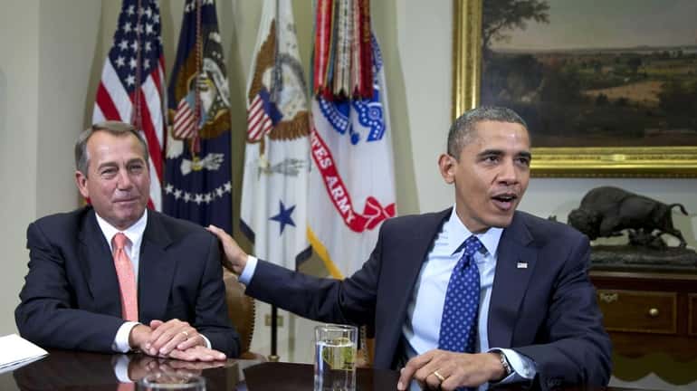 President Barack Obama acknowledges House Speaker John Boehner of Ohio...