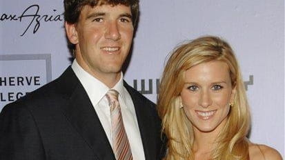 Giants quarterback Eli Manning and wife Abigal McGrew attend the...