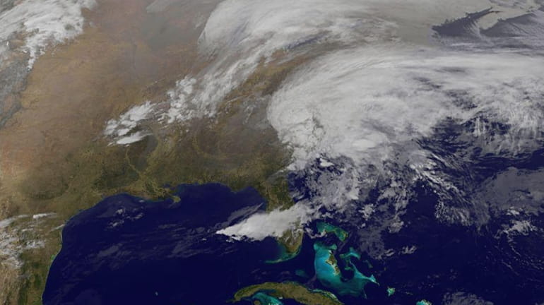 Satellite image taken at 9:02 EDT shows a winter storm...