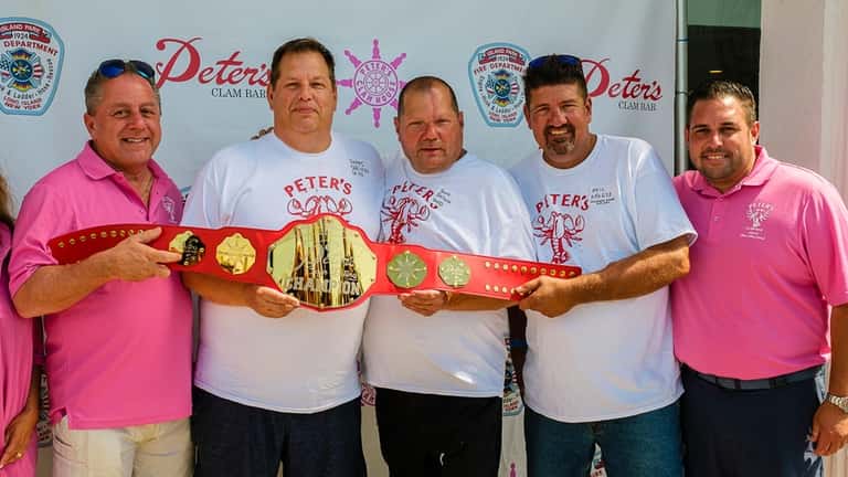Peter's Clam Bar owner Butch Yamali, left, presents the championship...