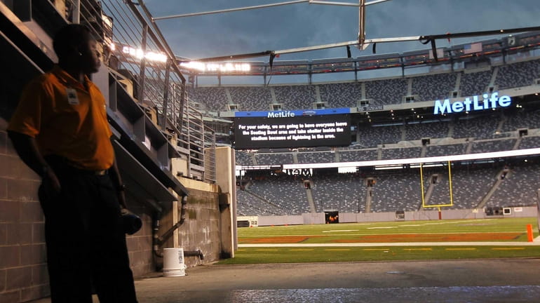 A security guard stands in the tunnel as the seating...