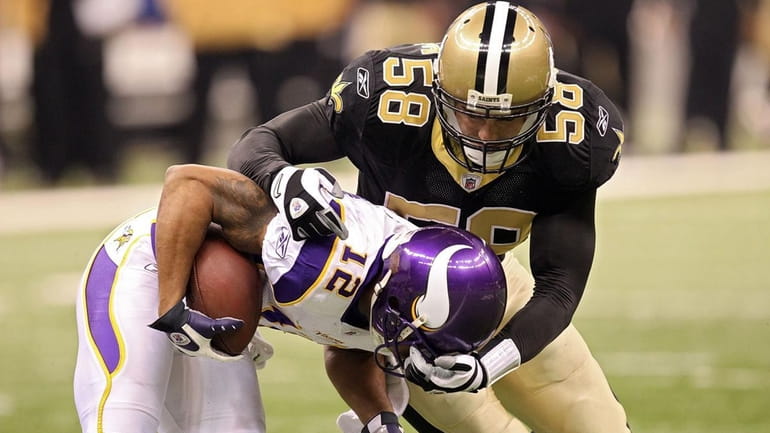 The Saints' Scott Shanle (58) tackles Percy Harvin of the...