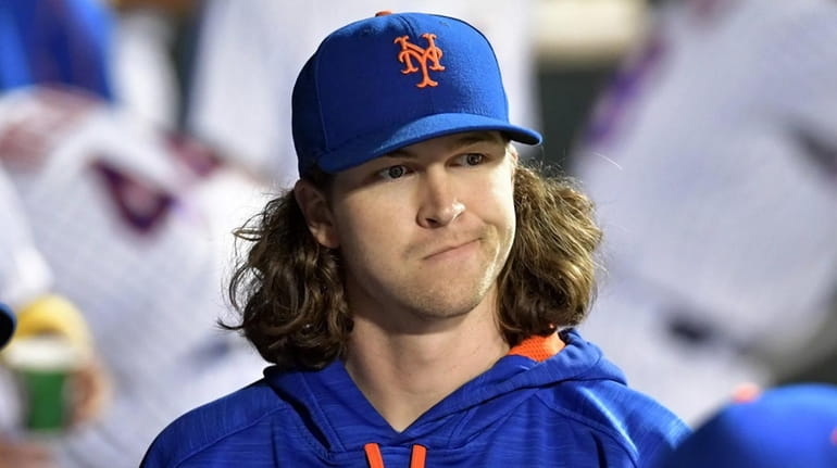 Jacob deGrom in the dugout during the game against the...
