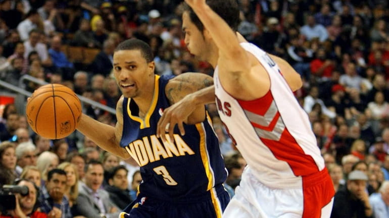 The Indiana Pacers' George Hill drives past the Toronto Raptors'...