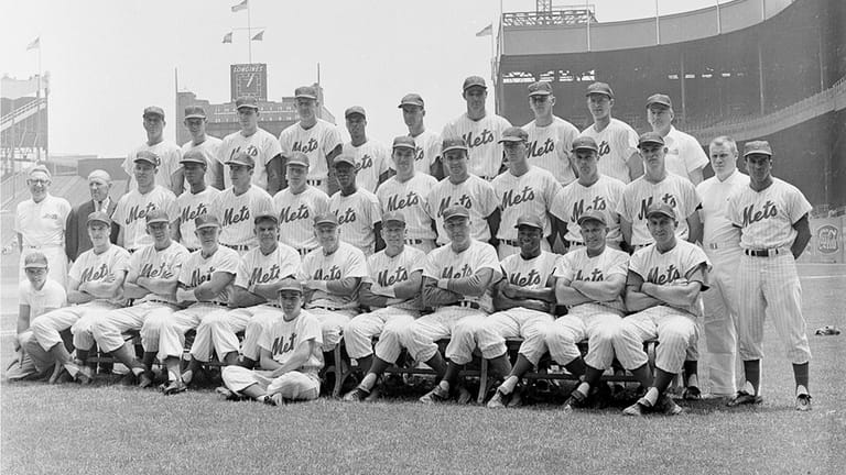 Team members of the New York Mets National League baseball...