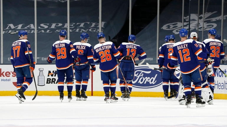 The Islanders skate off the ice after a loss against...