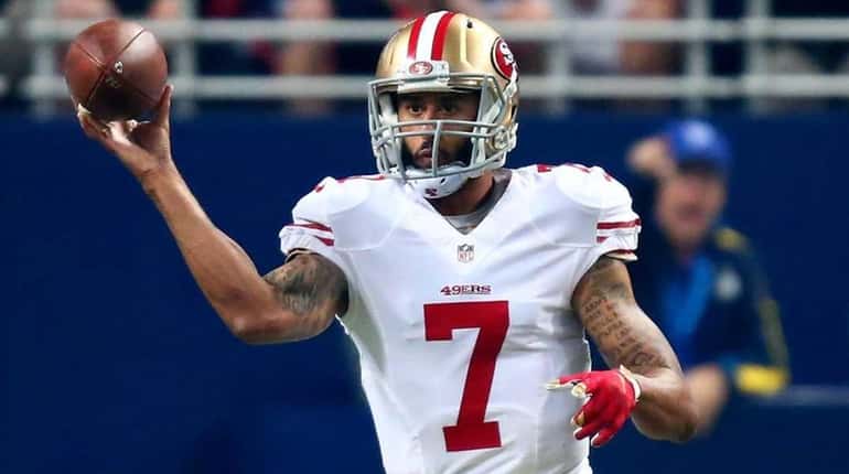 Colin Kaepernick of the San Francisco 49ers throws a pass...