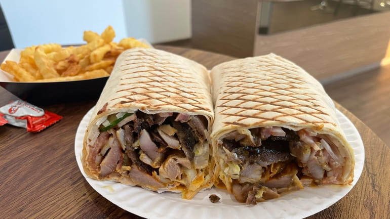 The mixed shawarma comes with pork, chicken and beef wrapped...