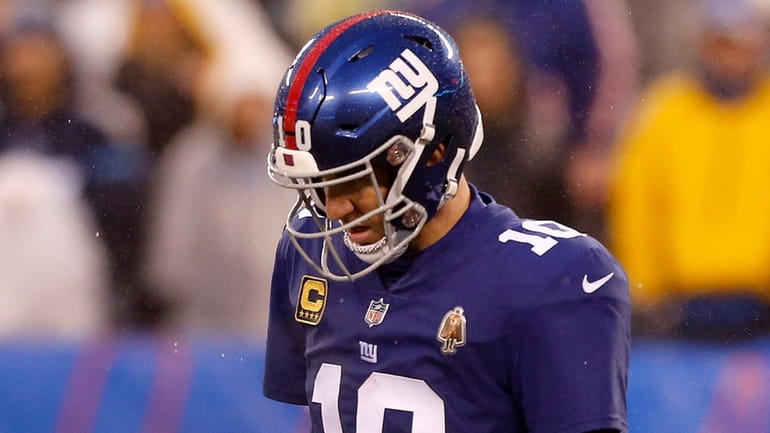 Giants quarterback Eli Manning looks on during the fourth quarter...