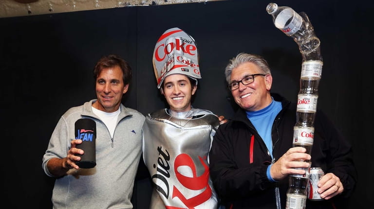 Chris Russo and Mike Francesa have pictures taken with fan...