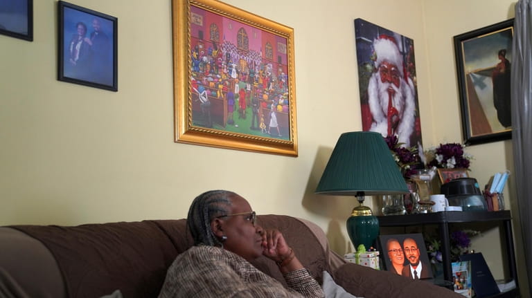 Wendy Owens, a United Methodist Minister, listens to her son,...