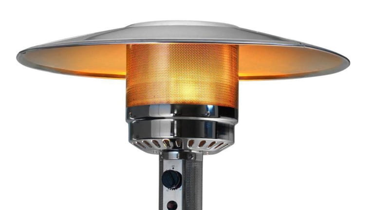 An outdoor patio propane heater with glowing flame