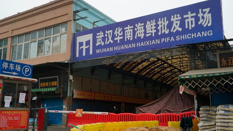 FILE - The Huanan Seafood Wholesale Market, sits closed in...