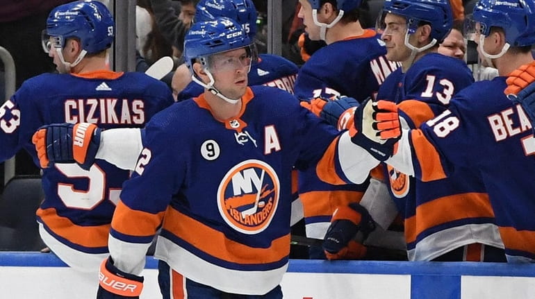 Islanders right wing Josh Bailey is congratulated by teammates after...