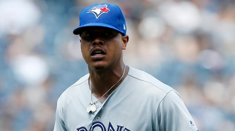 Blue Jays pitcher Marcus Stroman reacts during a game against the Yankees...