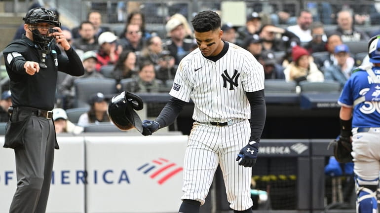 Yankees’ Juan Soto tosses his helmet after striking out swinging...