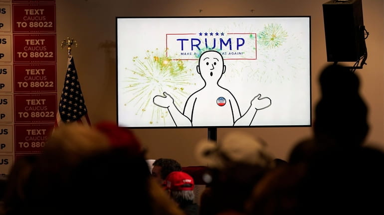 A video plays before former President Donald Trump speaks at...