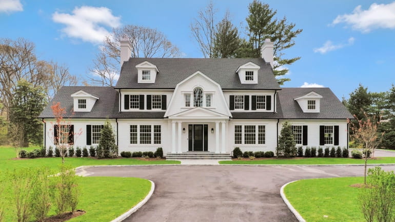 This new five-bedroom, 5,806-square-foot Colonial comes with private rights to Lloyd...