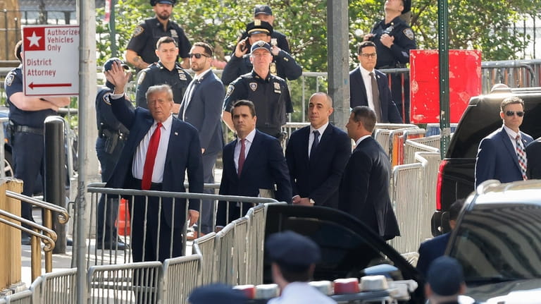 Former President Donald Trump arrives at Manhattan criminal court with...