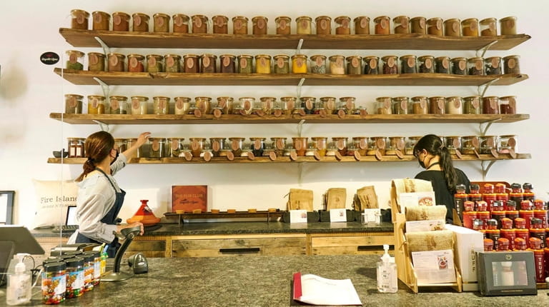 The spice wall at Sayville N Spice, a newly opened...