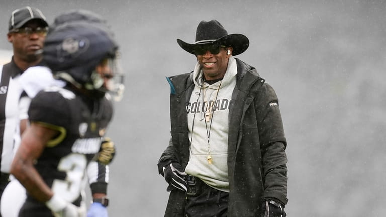 Colorado head coach Deion Sanders looks on during the first...
